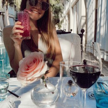 Cara Restaurant - Sitting outside at the hotel restaurant enjoying a butterfly pea cocktail! - New American Near Me - Los Angeles, California Cara Restaurant - Sitting outside at the hotel restaurant enjoying a butterfly pea cocktail! - New American Near Me - Los Angeles, California
