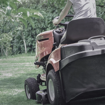 Immaculate Cuts Lawn - a man riding a lawn mower - Landscaping Near Me Immaculate Cuts Lawn - a man riding a lawn mower - Landscaping Near Me