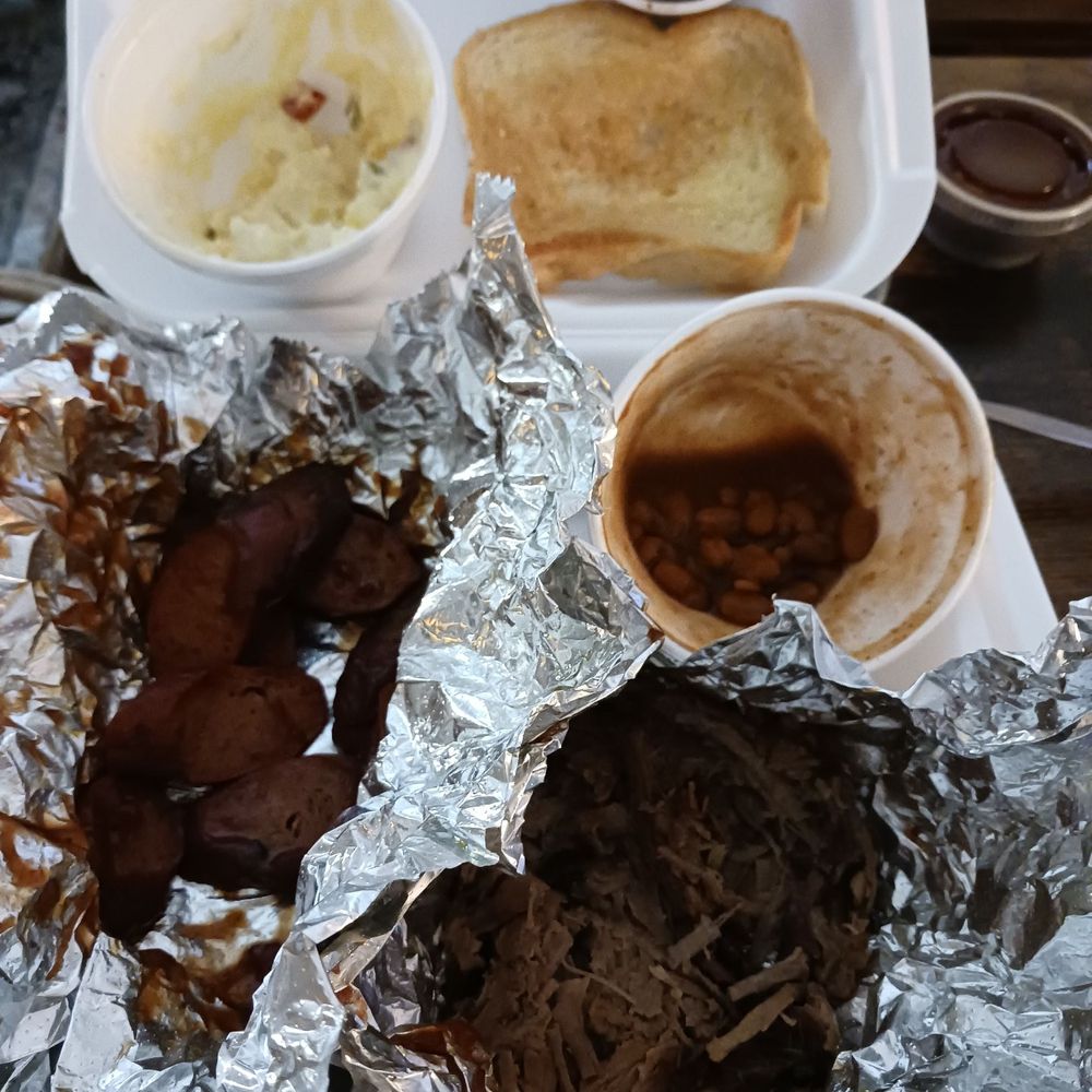 Hog Wild Pit Bar-B-Q - Spicy Sausage, brisket, baked beans, potato salad, and bread - Barbeque Near Me - Lincoln, Nebraska Hog Wild Pit Bar-B-Q - Spicy Sausage, brisket, baked beans, potato salad, and bread - Barbeque Near Me - Lincoln, Nebraska