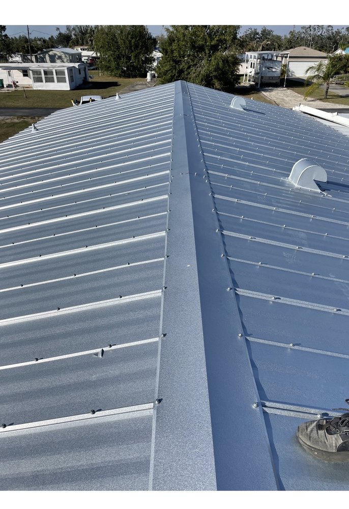 Slide of Ark Roofing and solar