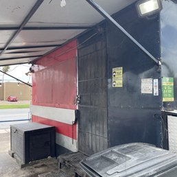 a black and red food truck a black and red food truck