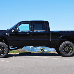 Ben Lifted 4 Wheel Drive & Hitch - 2010 Ford Harley Davidson F250 Super Duty with 8" Icon coil over lift, 22" BMF Novakaines, 37" Toyo Tires and Power Steps