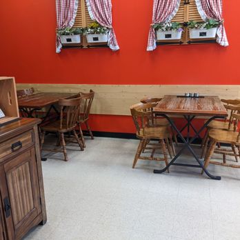 Swiss 2 Go - a dining area with tables and chairs - Sandwiches Near Me - Edmonton, Alberta
