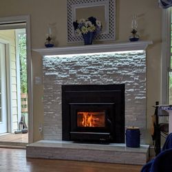 Ward Fireplaces & Stoves - Fireplace insert with Arctic White panels.