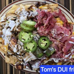 Toms Famous Family Restaurant - Tom's "DUI Fries", is the best value with pastrami, steak and chicken... fully loaded with flavor...