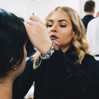 StyleBar - Natalie R doing makeup at New York Fashion Week - Hair Salons Near Me - Charlotte, North Carolina