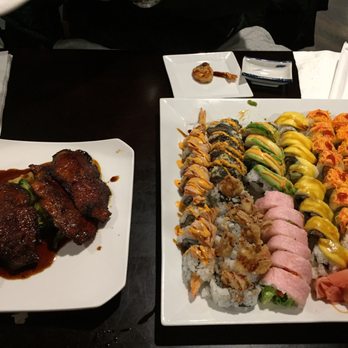 Arigato - Spicy Salmon on left, assorted Sushi on right as part of the all you can eat buffet. - Sushi Bars Near Me - Edgewater, New Jersey