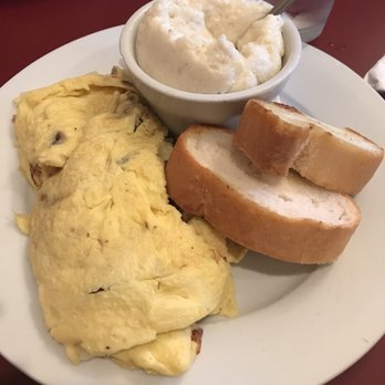 Cafe Conti - Omelette of the day with grits- DELICIOUS - Breakfast & Brunch Near Me - New Orleans, Louisiana Cafe Conti - Omelette of the day with grits- DELICIOUS - Breakfast & Brunch Near Me - New Orleans, Louisiana