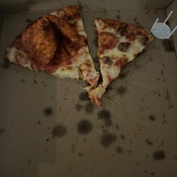 two slices of pizza in a box