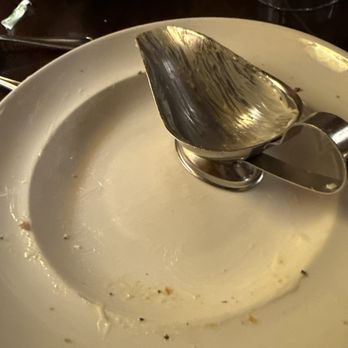 Cattlemens - The empty salad plate and the dressing dish wiped clean with the first basket of French bread. - Steakhouses Near Me - Livermore, California