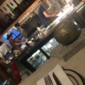 Le Comptoir du Vin - The kitchen staff working hard, creating awesome plates - Wine Bars Near Me - Baltimore, Maryland