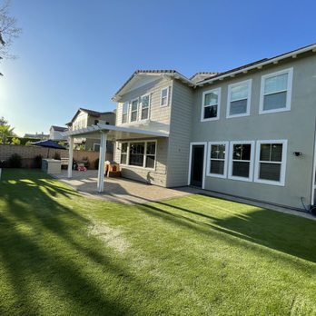 Brooker Associates - the back of a house with a lawn and a patio - General Contractors Near Me - La Habra, California Brooker Associates - the back of a house with a lawn and a patio - General Contractors Near Me - La Habra, California