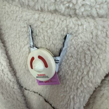 URM Thrift & Boutique  - Cut tag on inexpensive jacket to hide brand. - Thrift Stores Near Me - Covina, California
