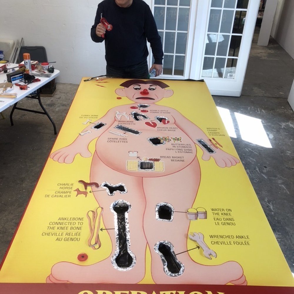 John Spinello plays the giant, hand-made Operation game at The Bazaar on Apricot & Lime John Spinello plays the giant, hand-made Operation game at The Bazaar on Apricot & Lime