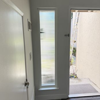 GV Home Solutions - Interior view: Milgard narrow window next to the front door - Windows Installation Near Me