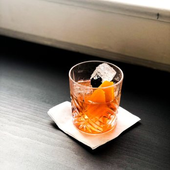 Moniker Cocktail Co - a drink in a glass on a napkin - Cocktail Bars Near Me - San Diego, California Moniker Cocktail Co - a drink in a glass on a napkin - Cocktail Bars Near Me - San Diego, California