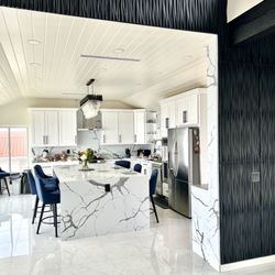 Kitchen & Bath Direct USA - White and blue shaker style kitchen with calacatte Fantom premium quartz countertop kitchen island