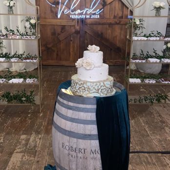 Goodies Cookies - 3-tier wedding cake and shelves with desserts - Bakeries Near Me - Visalia, California