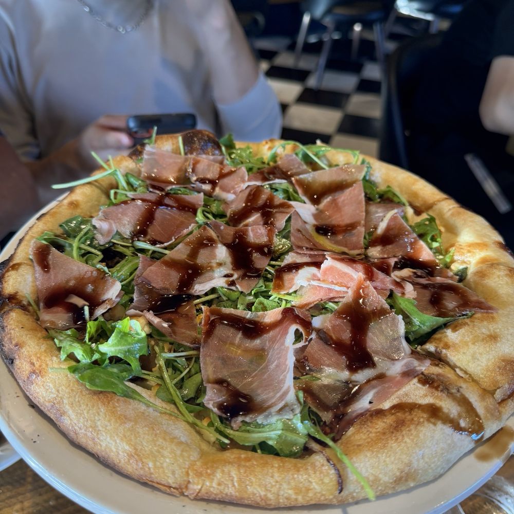 Market Tavern - Prosciutto Arugula Pizza with balsamic drizzle. - New American Near Me - Lodi, California