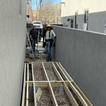 BC&E Construction - Crew starts on the alley decking, making this a much easier space to use rather than builder gravel. - General Contractors Near Me
