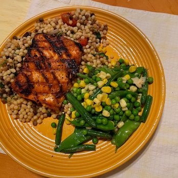 Avvio Ristorante - Salmon and cous cous. Only two pieces of watercress & no cucumber  but delicious. I made the veg at home! - New American Near Me - Cranston, Rhode Island