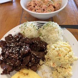Spicy poke and Beef Teriyaki, scoops rice and scoop Mac salad Spicy poke and Beef Teriyaki, scoops rice and scoop Mac salad