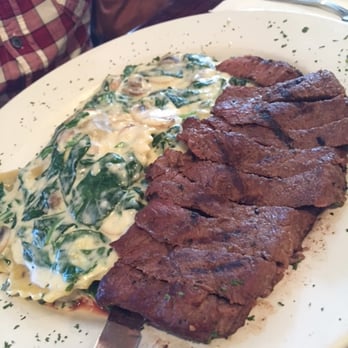 Lady C’s - Say Steak:New York steak w/spinach, garlic, mushrooms & herb ravioli in a parmesan cream sauce served w/garlic herbed toast (not pictured). - Breakfast & Brunch Near Me - Tarzana, California Lady C’s - Say Steak:New York steak w/spinach, garlic, mushrooms & herb ravioli in a parmesan cream sauce served w/garlic herbed toast (not pictured). - Breakfast & Brunch Near Me - Tarzana, California