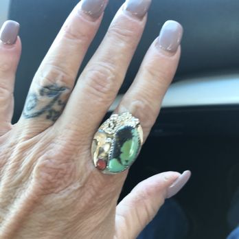 Mary's Bar - a woman's hand with a ring on it - Bars Near Me - Cerrillos, New Mexico