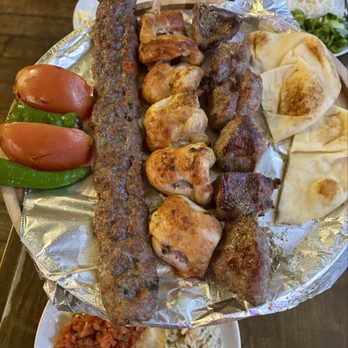 Turkish Kitchen - Adana, chicken, and lamb kebabs with pita and tomatoes and peppers on a platter. - Turkish Near Me - Madison, Wisconsin