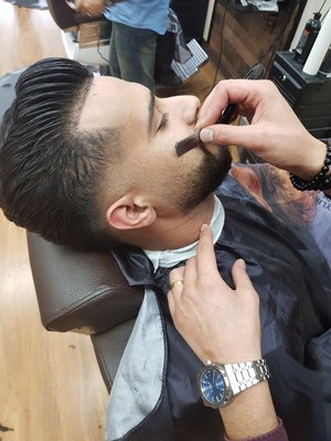 Fresh Beard Trim - Elevate your style with a perfect beard trim. Our skilled barbers craft clean lines and sharp edges, giving you a polished look that's always on point.