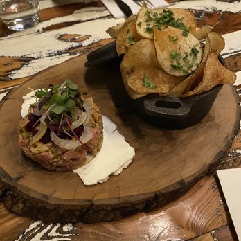 Revelry - Lamb tartare over crème fraîche with pickle chanterelles, pickled fennel, beats, topped with green onion served with homemade chips - Wine Bars Near Me - Bozeman, Montana Revelry - Lamb tartare over crème fraîche with pickle chanterelles, pickled fennel, beats, topped with green onion served with homemade chips - Wine Bars Near Me - Bozeman, Montana