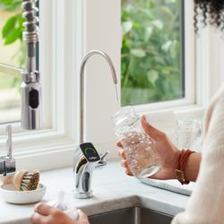 Woman filling bottle with Culligan RO drinking water