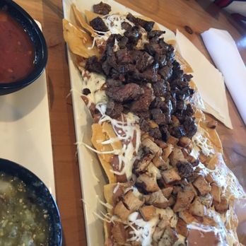 Margaritaville - Half chicken n half steak nachos. So bomb - Seafood Near Me - Capitola, California