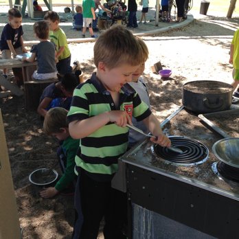Awakening Seed School - making mud pies in the outdoor kitchen - Elementary Schools Near Me - Phoenix, Arizona
