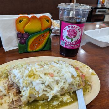 La Rosa de Michoacan - Pork burrito with rice and beans. I had it wet with the salsa on top with sour cream and let us some tomato around it. It was very good. - Mexican Near Me - Bullhead City, Arizona La Rosa de Michoacan - Pork burrito with rice and beans. I had it wet with the salsa on top with sour cream and let us some tomato around it. It was very good. - Mexican Near Me - Bullhead City, Arizona