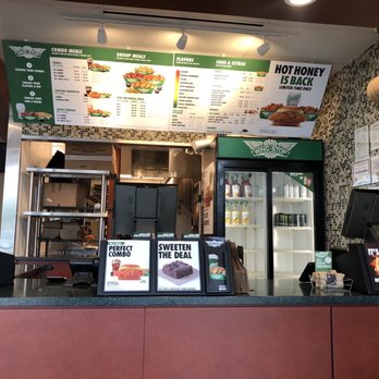Wingstop - the menu and counter of the restaurant - Chicken Wings Near Me - North Richland Hills, Texas