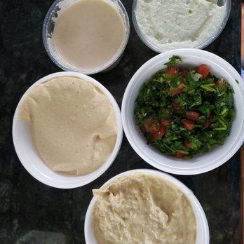Cedar Grille - Part of the sampler combo: hummus, baba ghanouj, garlic, tabouli and tahini - Mediterranean Near Me - Troy, Michigan Cedar Grille - Part of the sampler combo: hummus, baba ghanouj, garlic, tabouli and tahini - Mediterranean Near Me - Troy, Michigan