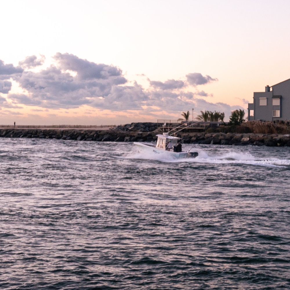 a boat in a body of water a boat in a body of water