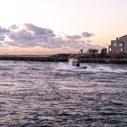 a boat in a body of water a boat in a body of water