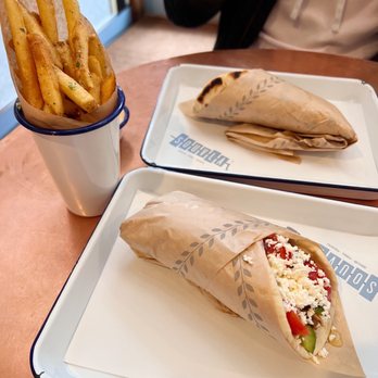 Souvla - Greek Fries; Snake River Farms Pork Shoulder (Front); Superior Farm Lamb Leg (Back) - Greek Near Me - San Francisco, California