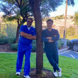 Wright Perio & Implants - Dr. Wright and Dr. Le chilling after a long day
