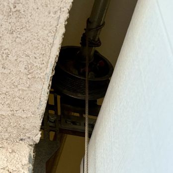 Mikes Garage Doors - The cabling wound over itself on both sides - Garage Door Services Near Me Mikes Garage Doors - The cabling wound over itself on both sides - Garage Door Services Near Me