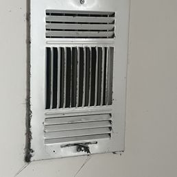 Every air vent and smoke detector had black dust bunnies dangling from them. Every air vent and smoke detector had black dust bunnies dangling from them.