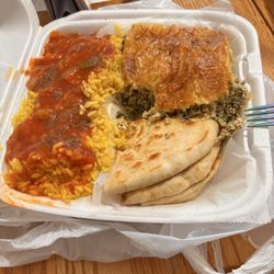 Greek Pantheon - Clinton Township - Carryout order of spinach pie with rice pilaf and pita bread. Cole slaw on the side (not shown)