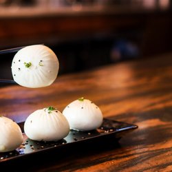 Dough Zone Dumpling House - San Mateo - Our Q-Bao are tasty buns filled with moist pork and wrapped with half fluffy, half crispy dough.