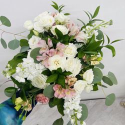 Cuts Creative Florist - Creating a bridal bouquet for a wedding