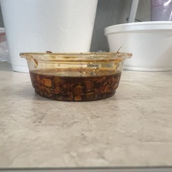 Plaza Cafe & Grill - Half filled container of chili oil - Burgers Near Me - Sacramento, California Plaza Cafe & Grill - Half filled container of chili oil - Burgers Near Me - Sacramento, California