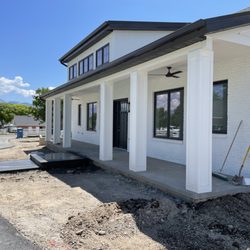Avius Concrete and Design - Full view of porch and landing steps. Porch cap and landing steps, exposed concrete finish.