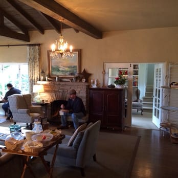 Sandpiper Inn - Living area fireplace and library behind - Hotels Near Me - Carmel, California