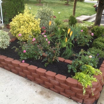 Visionary Lawn Services - a flower bed in the front yard - Lawn Services Near Me Visionary Lawn Services - a flower bed in the front yard - Lawn Services Near Me